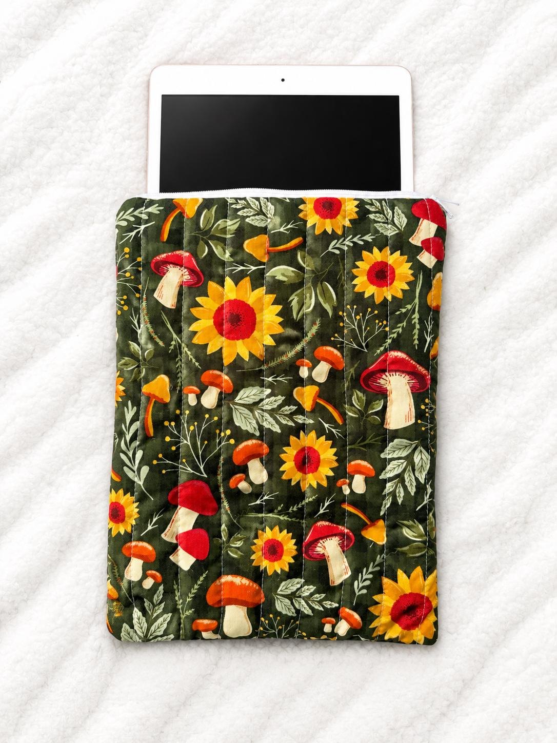 Quilted tablet sleeve with sunflower and mushroom fabric